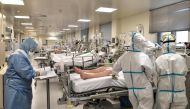 Nurses attend a Covid-19 patient at the intensive care unit of a hospital in Athens on November 20, 2020.  AFP / LOUISA GOULIAMAKI