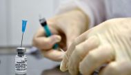 (FILES) In this file photo taken on September 10, 2020 a nurse prepares to inoculate volunteer Ilya Dubrovin, 36, with Russia's new coronavirus vaccine in a post-registration trials at a clinic in Moscow. Russia's Sputnik V coronavirus vaccine is 95 perce
