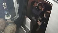This video grab taken on November 27, 2020 from an AFP video shows CCTV camera footage, widely distributed on social networks, shows producer Michel Zecler being beaten up by police officers at the entrance of a music studio in the 17th arrondissement of 