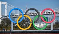 The Olympic rings are reinstalled at the waterfront in Tokyo on December 1, 2020. / AFP / Charly Triballeau