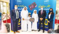 Mall of Qatar management team with a winner during the handover ceremony.