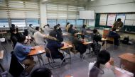 Students wait for the start of the annual college entrance examinations amid the coronavirus disease (COVID-19) pandemic at an exam hall in Seoul, South Korea, December 3, 2020. REUTERS/Kim Hong-Ji/Pool
