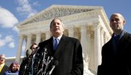 FILE PHOTO: Texas Attorney General Ken Paxton addresses reporters on the steps of the U.S. Supreme Court in Washington March 2, 2016.REUTERS/Kevin Lamarque/File Photo

