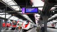 FILE PHOTO: A display shows the departure time of a train of Swiss train operator SBB from Zurich to Milan, Italy, REUTERS/Arnd Wiegmann