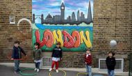 FILE PHOTO: Children use hoops for social distancing at L'Ecole des Petits, an independent French bilingual school, as the coronavirus disease (COVID-19) lockdown eases in Fulham, London, Britain, June 9, 2020. REUTERS/Kevin Coombs 