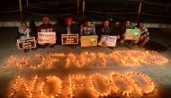 Members of human rights organisations hold placards in support of farmers during a protest against the central government's recent agricultural reforms in Amritsar on December 10, 2020. / AFP / Narinder NANU

