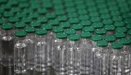 Vials of AstraZeneca's COVISHIELD, coronavirus disease (COVID-19) vaccine, are seen before they are packaged inside a lab at Serum Institute of India, Pune, India, November 30, 2020. REUTERS/Francis Mascarenhas/File Photo