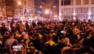Members of the far-right group Proud Boys kneel as they gather near Black Lives Matter Plaza in Washington, U.S., December 12, 2020. Reuters/Erin Scott
 