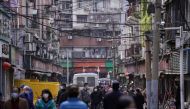 People wearing face masks walk on a street market in Wuhan, Hubei province, the epicentre of China's novel coronavirus disease (COVID-19) outbreak, April 6, 2020. RUETERS/Aly Song/File Photo