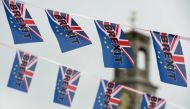 (FILES) In this file photo taken on June 13, 2016, Pro-Brexit flags fly from a fishing boat moored in Ramsgate on June 13, 2016. AFP / Chris J Ratcliffe 