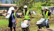 Aid workers bring aid to people who are returning to their houses, completely destroyed by Cyclone Yasa, northern Bua, Vanua Levu, Fiji, December 19, 2020, in this photo supplied by IFRC. Ponipate/IFRC/via Reuters