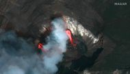 This handout satellite image taken and released by Maxar on December 21, 2020 shows the Kilauea volcano on Hawaii's Big Island, which began erupting late on December 20. The Kilauea volcano on Hawaii's Big Island erupted late on December 20, authorities s