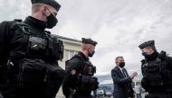 French Gendarmes speak with a man at the Gendarmerie in Ambert, central France on December 23, 2020, after three gendarmes were killed and a fourth wounded by a gunman they confronted in response to a domestic violence call in Saint-Just. AFP / Olivier Ch