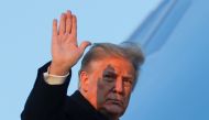 U.S. President Donald Trump waves as he boards Air Force One at Joint Base Andrews in Maryland, U.S., December 23, 2020. (REUTERS/Tom Brenner)