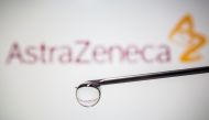 AstraZeneca's logo is reflected in a drop on a syringe needle in this illustration taken November 9, 2020. REUTERS/Dado Ruvic/Illustration/File Photo