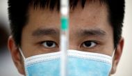 A man works in a laboratory of Chinese vaccine maker Sinovac Biotech, developing an experimental coronavirus disease (COVID-19) vaccine, during a government-organized media tour in Beijing, China, Sept. 24, 2020. Reuters/Thomas Peter/File Photo