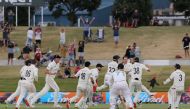 New Zealand celebrate their victory after taking the final wicket on the fifth day of the first cricket Test match between New Zealand and Pakistan at the Bay Oval in Mount Maunganui on December 30, 2020. / AFP / MICHAEL BRADLEY
