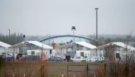 Cars enter the testing centre amid the outbreak of the coronavirus disease (COVID-19) in Milton Keynes, Britain, January 1, 2021. REUTERS/Andrew Boyers