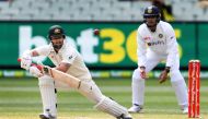 Australia's Matthew Wade (L) plays a shot as India's Shubman Gill looks on during the third day of the second cricket Test match between Australia and India at the MCG in Melbourne on December 28, 2020. AFP / WILLIAM WEST /