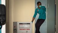 An officer moves a box of Sinovac's vaccine for coronavirus disease (COVID-19) from Biofarma to the pharmacy storage room of the local health department, as it is arrives in Semarang, Central Java province, Indonesia, January 4, 2021 in this photo taken b
