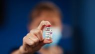 A healthcare worker holds a vial of AstraZeneca coronavirus disease (COVID-19) vaccine at the Pentland Medical Practice, in Currie, Scotland, Britain January 7, 2021. REUTERS/Russell Cheyne/Pool