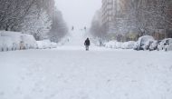 A person walks down the street during a heavy snowfall in Madrid, Spain, January 9, 2021. REUTERS/Sergio Perez