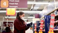 A member of staff wearing a face mask works at a Sainsbury's supermarket, amid the spread of the coronavirus disease (COVID-19), in London, Britain January 11, 2021. REUTERS/Hannah McKay
