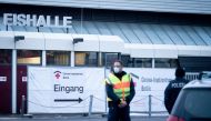 Police guards a vaccination centre temporarily set up at the Erika-Hess ice stadium, amid the spread of the coronavirus disease (COVID-19), in Berlin, Germany, January 14, 2021. Kay Nietfeld/Pool via Reuters 