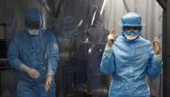 Specialists are seen at Chumakov Federal Scientific Center for Research and Development of Immune-and-Biological Products, which conducts development of Russia's third vaccine against the coronavirus disease (COVID-19), in Moscow, Russia January 13, 2021.