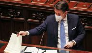 Italy's Prime Minister Giuseppe Conte looks at papers during a debate that followed his speech at the lower chamber of Parliament, in Rome, Italy, January 18, 2021. Alessandra Tarantino/Pool via REUTERS