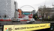 A sign of a NHS vaccination centre is seen, amid the spread of the coronavirus disease (COVID-19), in Wembley, London, Britain, January 18, 2021. REUTERS/Matthew Childs