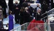 Lady Gaga sings the National Anthem as U.S. Vice President Mike Pence and Vice President-elect Kamala Harris look on during the National Anthem during the inauguration of Joe Biden as the 46th President of the United States on the West Front of the U.S. C