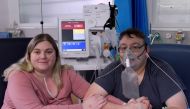 Lizzie Kerr, 31, and Simon O'Brien, 36, embrace in a Covid-19 ward, days after they married in an ICU (Intensive Care Unit) when both had become critically ill with the coronavirus disease, and were uncertain of their chances of surviving, in Milton Keyne