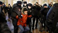 Law enforcement officers detain a participant of a rally to protest the detainment of Russian opposition leader Alexei Navalny, in Saint Petersburg, Russia January 18, 2021. REUTERS/Anton Vaganov
