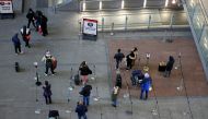 People queue for COVID-19 tests at a testing centre, as tighter rules for international travellers start, at terminal 2 of the Heathrow Airport, amid the spread of the coronavirus disease (COVID-19) pandemic, London, Britain, January 18, 2021. REUTERS/Hen
