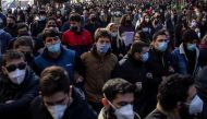 Greek university students, wearing protective face masks, shout slogans during a demonstration against government plans to set up a university police, amid the coronavirus disease (COVID-19) pandemic, in Athens, Greece, January 21, 2021. REUTERS/Alkis Kon