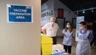 British Prime Minister Boris Johnson meets staff and patients at Barnet FC's ground, The Hive, which is being used as a coronavirus vaccination centre, in north London, Britain January 25, 2021. Stefan Rousseau/Pool via Reuters
 