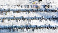 A worker digs a grave in a cemetery amid the coronavirus disease (COVID-19) outbreak in Manchester, Britain, January 25, 2021. Picture taken with a drone. REUTERS/Phil Noble
