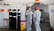 Healthcare workers chat at a temporary ward set up during the coronavirus disease (COVID-19) outbreak, at Steve Biko Academic Hospital in Pretoria, South Africa, January 19, 2021. Phill Magakoe/Pool via Reuters/File Photo
