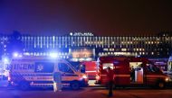 Medical personnel stand next to ambulances with Covid-19 patients as they wait in the queue at Santa Maria hospital, amid the coronavirus disease (COVID-19) pandemic in Lisbon, Portugal, January 27, 2021. Reuters/Pedro Nunes