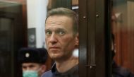 A still image taken from video footage shows Russian opposition leader Alexei Navalny, who is accused of flouting the terms of a suspended sentence for embezzlement, inside a defendant dock during the announcement of a court verdict in Moscow, Russia Febr