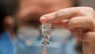 A health worker draws a dose of the AstraZeneca's coronavirus disease (COVID-19) vaccine, at the vaccination centre in the Newcastle Eagles Community Arena, in Newcastle upon Tyne, Britain, January 30, 2021. REUTERS/Lee Smith
