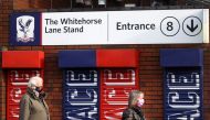People arrive to receive the COVID-19 vaccine at Crystal Palace Football Club Vaccination Centre, amid the outbreak of the coronavirus disease (COVID-19) in London, Britain February 4, 2021. REUTERS/Hannah McKay