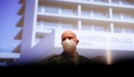 Colonel Dr. Jens-Peter Evers speaks during a news conference on the first day staffing an ICU unit at Hospital da Luz, amid the coronavirus disease (COVID-19) pandemic, in Lisbon, Portugal February 8, 2021. REUTERS/Pedro Nunes