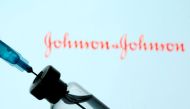 A vial and syringe are seen in front of a displayed Johnson&Johnson logo in this illustration taken January 11, 2021. REUTERS/Dado Ruvic/Illustration/File Photo