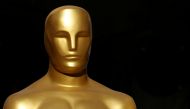 FILE PHOTO: An Oscar statue is shown in a shopping mall next to the arrivals area as preparation for the 92nd Academy Awards continues in Los Angeles, California, U.S., February 7, 2020. REUTERS/Mike Blake/File Photo
