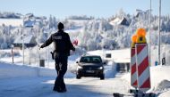 German border police officers stop a car at the border as controls between Germany and the Czech Republic have been re-established, while the spread of the coronavirus disease (COVID-19) continues in Zinnwald, Germany, February 14, 2021. REUTERS/Matthias 