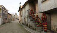 Villagers wearing traditional costumes mark the Shrovetide Sunday festival on the empty street instead of the yearly crowded carnival which was prohibited due to lockdown restrictions amid the coronavirus disease (COVID-19) pandemic in Podence, Portugal. 