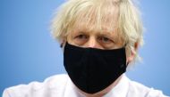 Britain's Prime Minister Boris Johnson visits a coronavirus disease (COVID-19) vaccination centre at Cwmbran Stadium in Cwmbran, South Wales, Britain February 17, 2021. Geoff Caddick/Pool via Reuters