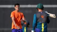 FILE PHOTO: Cricket - ICC Cricket World Cup - Australia Training - Lord's Cricket Ground, London, Britain - June 28, 2019 Arjun Tendulkar, son of Sachin Tendulkar, speaks with Australia's Aaron Finch during training Action Images via Reuters/Paul Childs/F